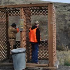 Two men clay shooting